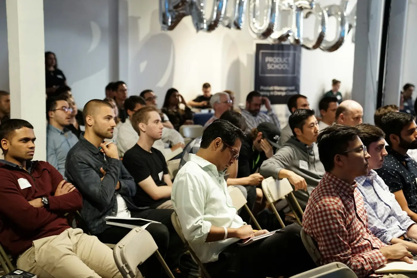 Members listening to a talk at a community meetup
